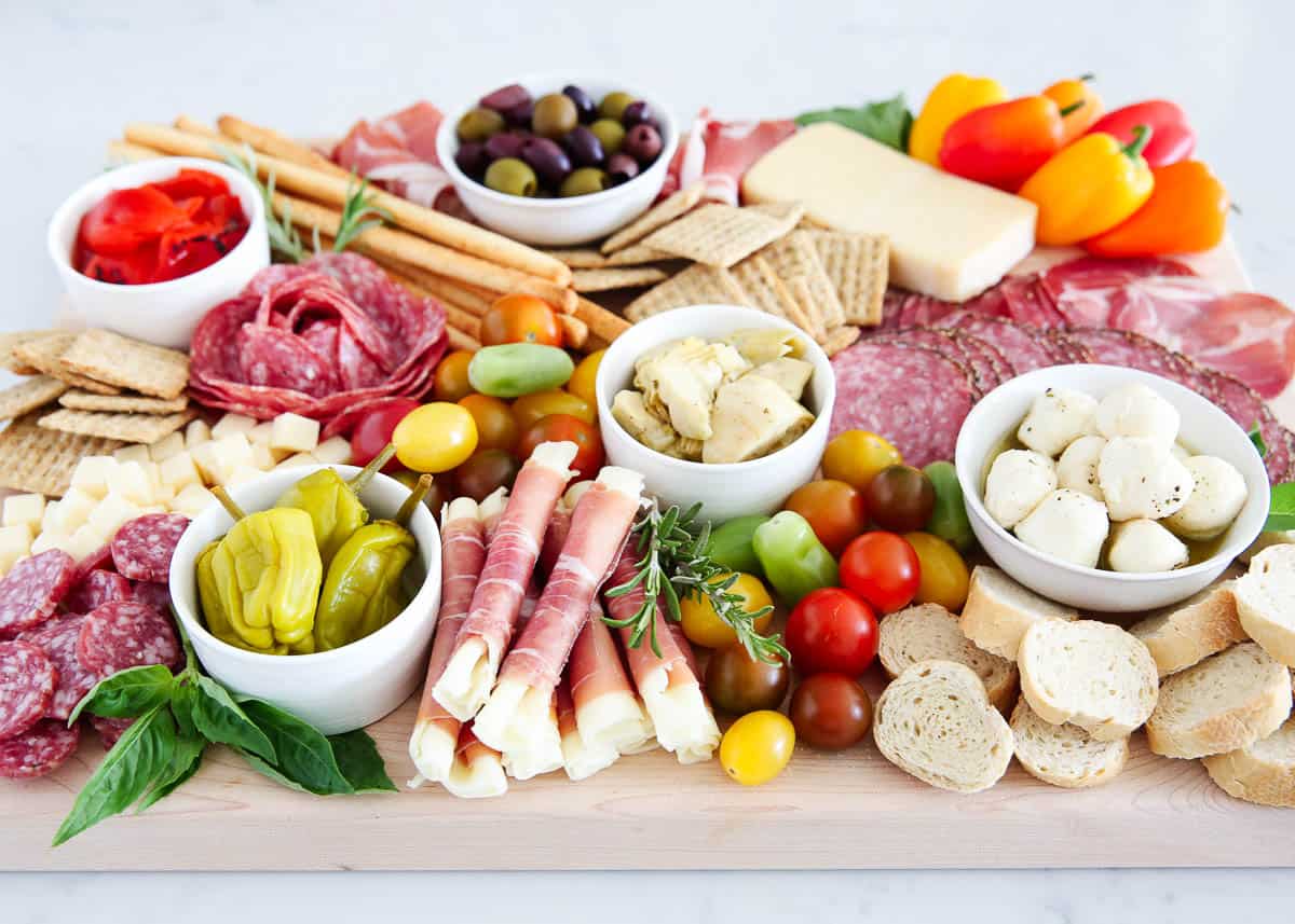 Antipasto platter on wooden board.