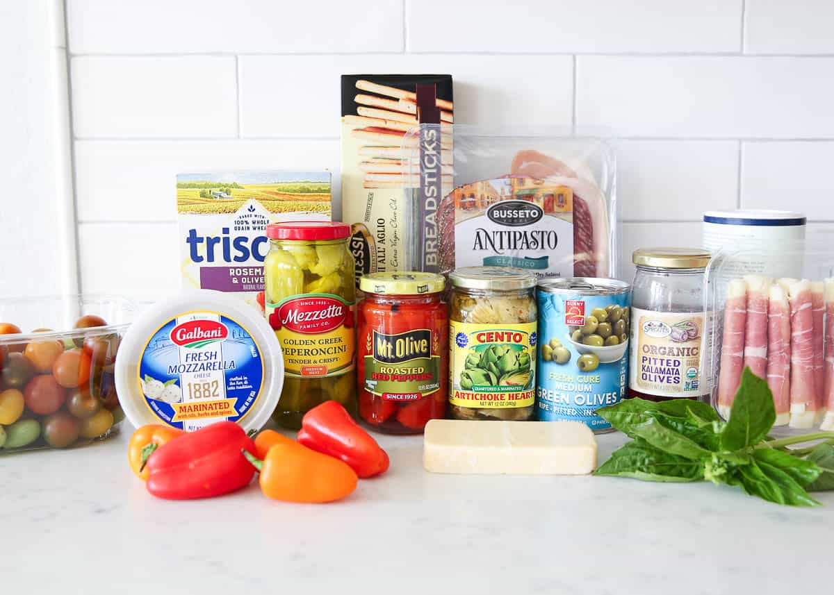 Antipasto platter ingredients on countertop.