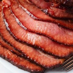 Sliced baked ham on a plate.