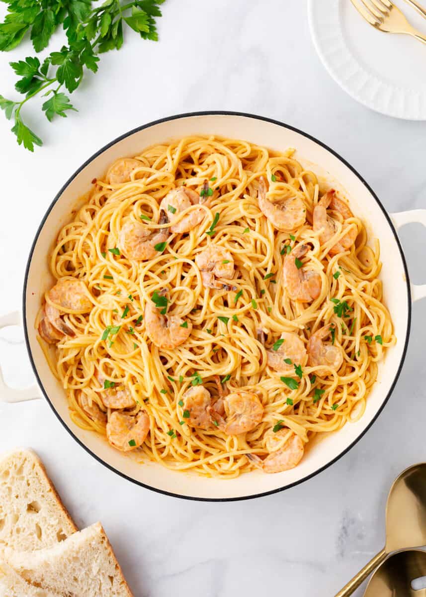 Bang bang shrimp pasta in a white pot.