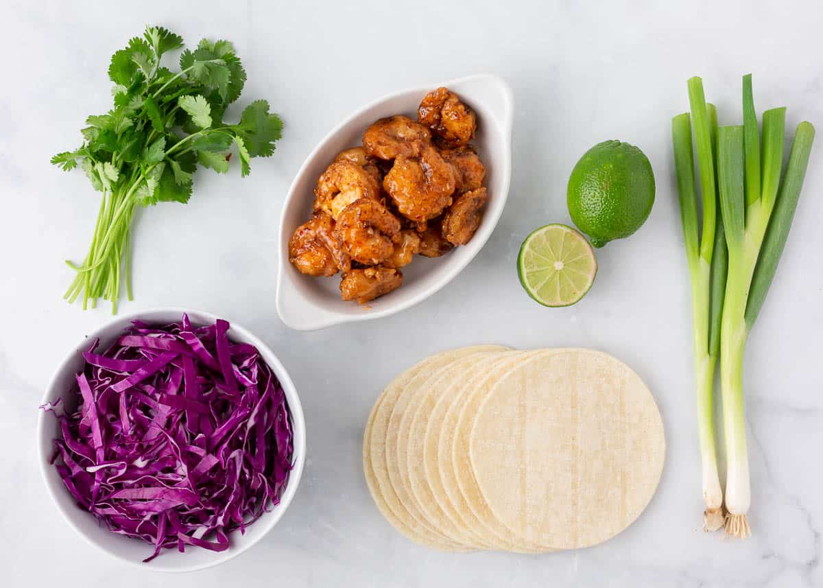 Bang bang shrimp taco ingredients on counter.