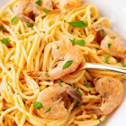 Bang bang shrimp pasta in a white bowl.