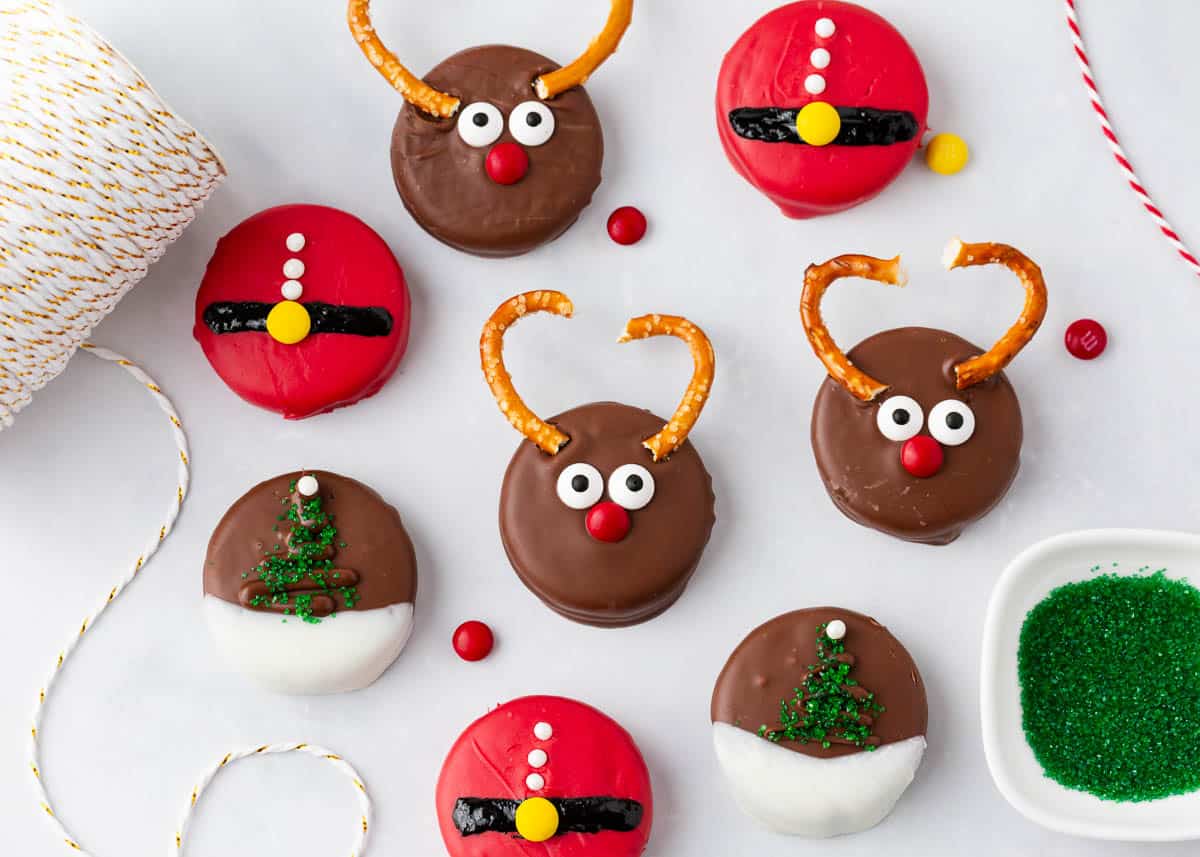 Christmas oreos on a marble counter.