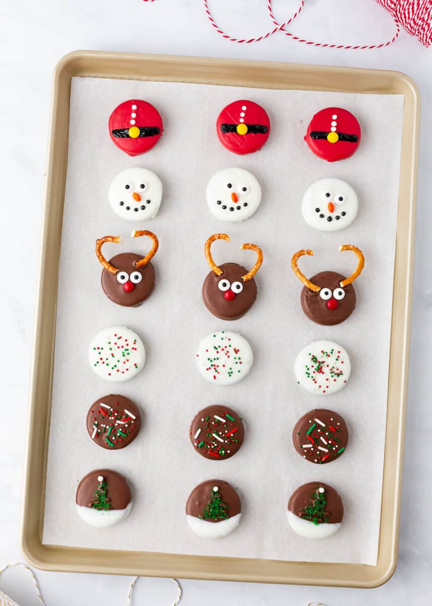 Christmas oreos on a baking sheet. 