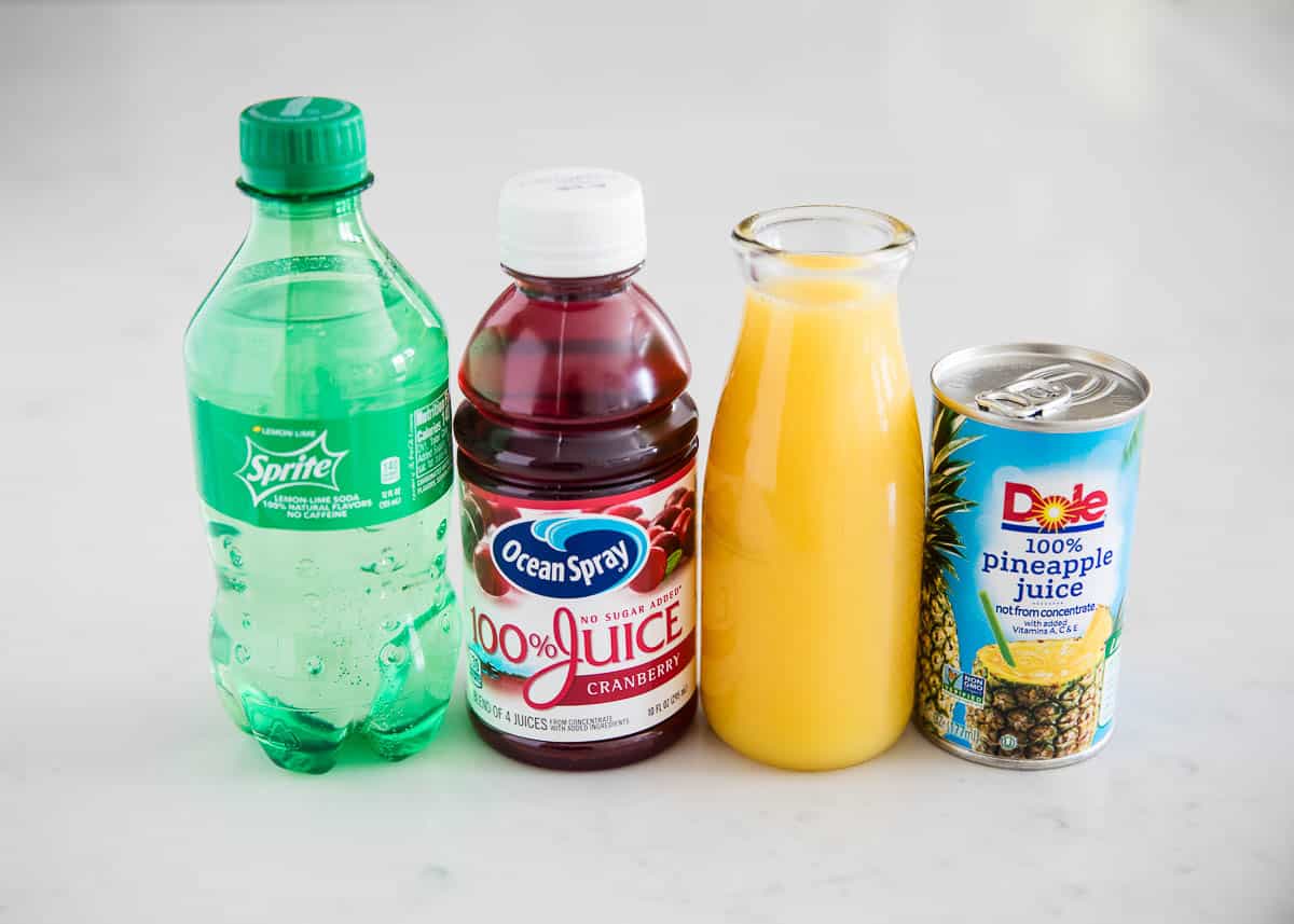 Christmas punch ingredients on counter.