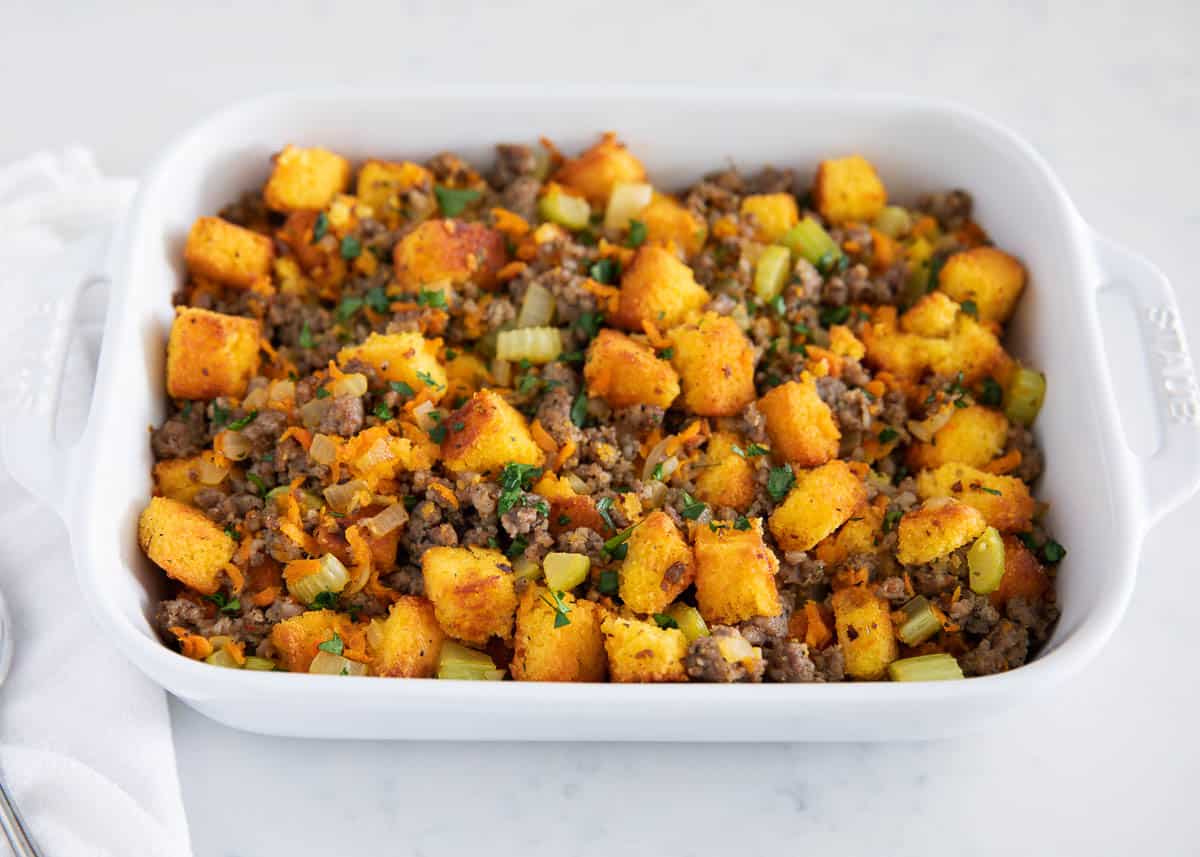 Cornbread stuffing in a white dish.