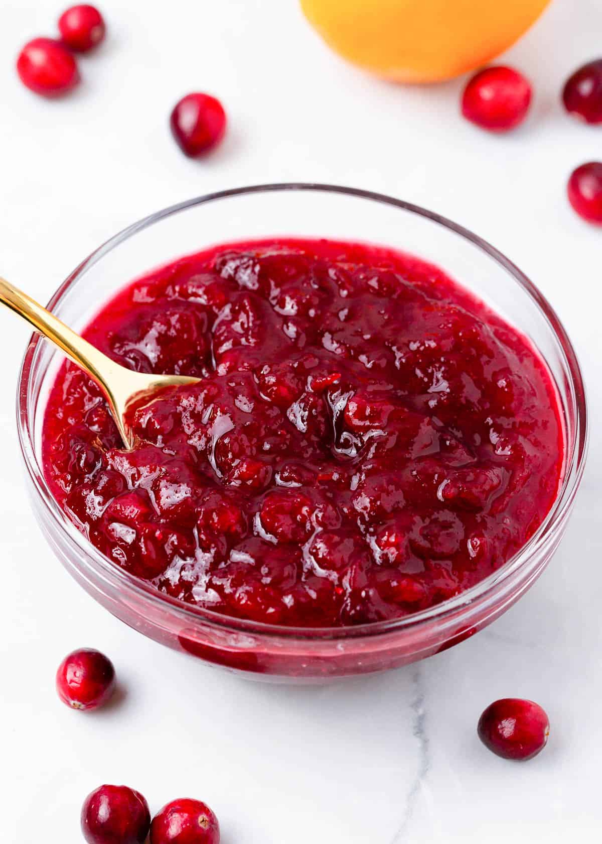 Cranberry sauce in a glass bowl.