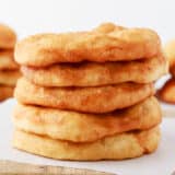 Stack of fry bread on cutting board.