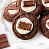 Hot chocolate cookies on a white cake plate.