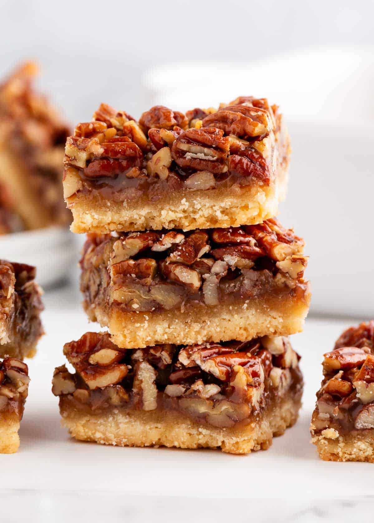 Pecan pie bars on a marble countertop.