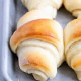 Potato rolls on baking sheet.