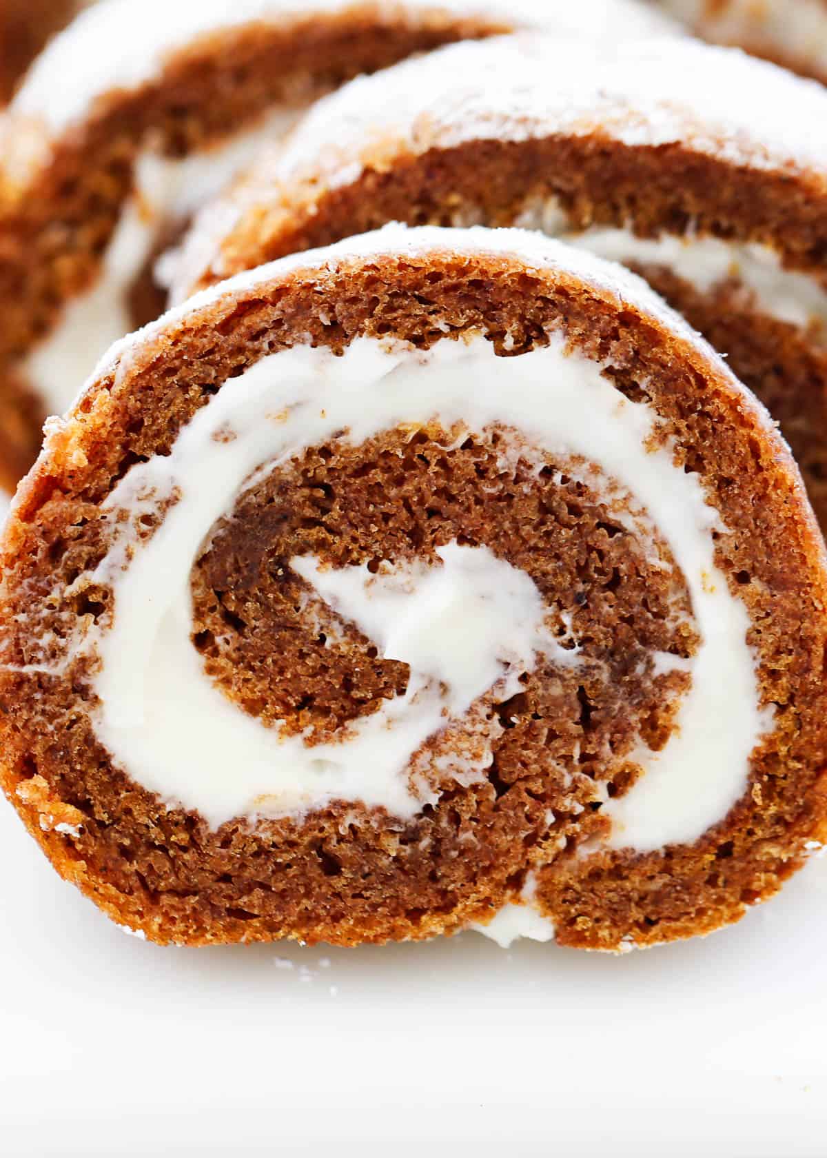 Sliced pumpkin roll on the counter.