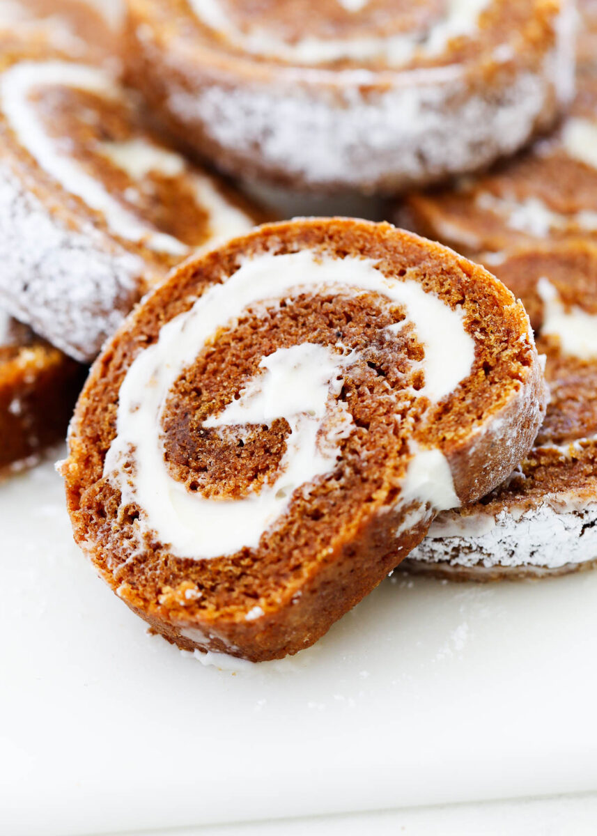 Sliced pumpkin roll on plate.