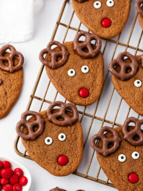 Reindeer cookies on a wire cooling rack.