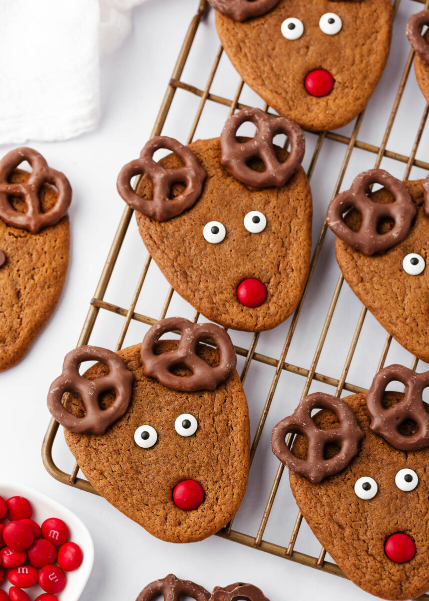 Reindeer cookies on a wire cooling rack.