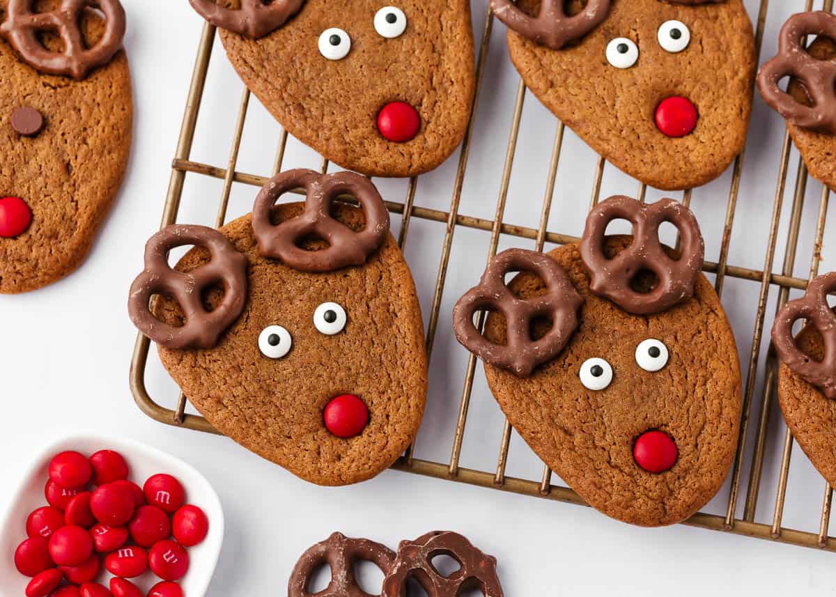 Reindeer cookies on a metal cooling rack.