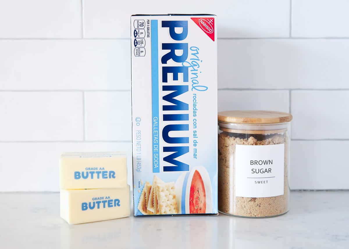 Saltine cracker toffee ingredients on marble counter.