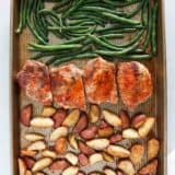 Sheet pan pork chops with potatoes and green beans.