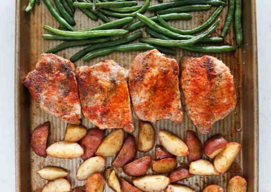 Sheet pan pork chops with potatoes and green beans.