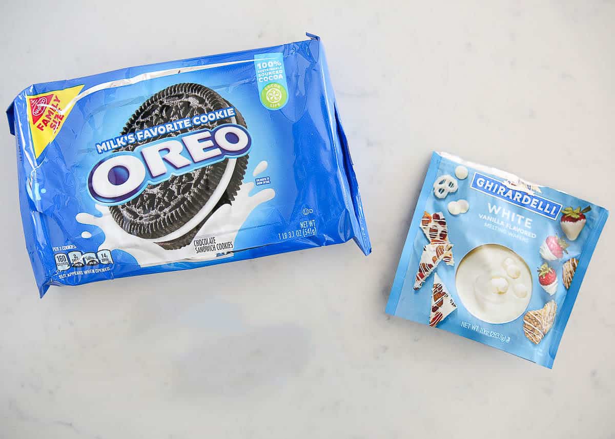 White chocolate and oreos on counter.
