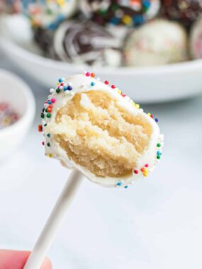 Cake pop with a bite taken.