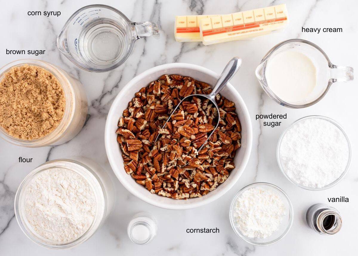 Pecan pie bar ingredients including butter, flour, pecans, brown sugar, corn syrup, heavy cream.