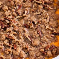 Sweet potato casserole in a white baking dish.
