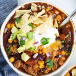 Turkey chili in a white bowl.