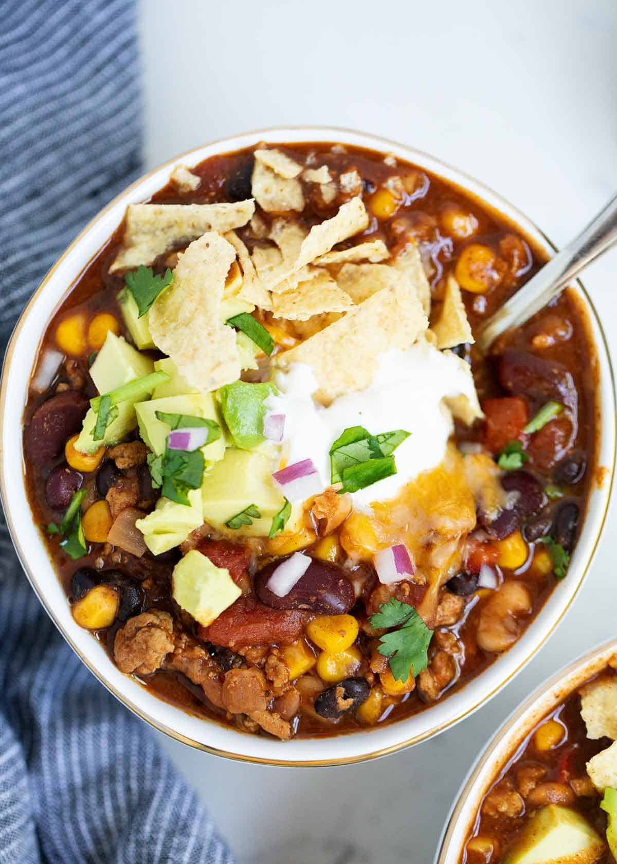 Turkey chili in a white bowl.