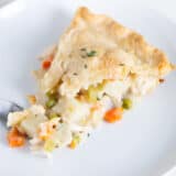 Slice of turkey pot pie on a plate.