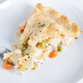 Slice of turkey pot pie on a plate.