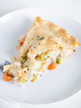 Slice of turkey pot pie on a plate.