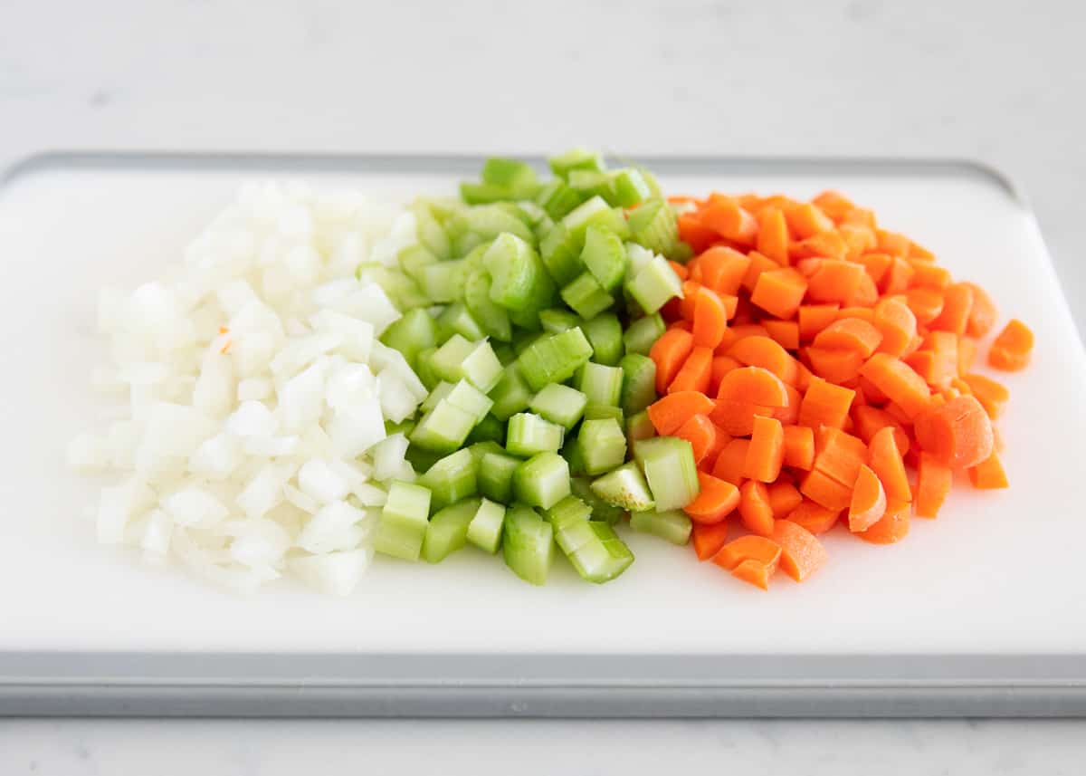 Sliced vegetables on a cutting board.