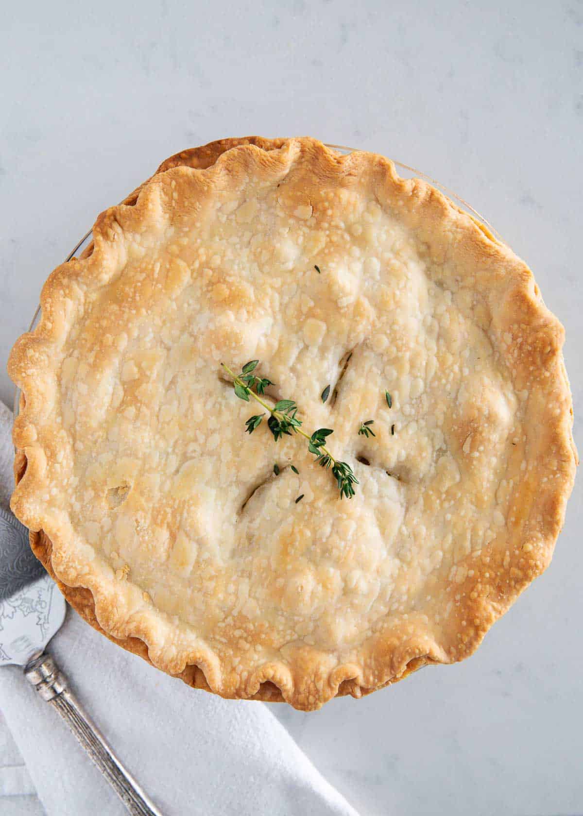 Turkey pot pie on a marble counter.