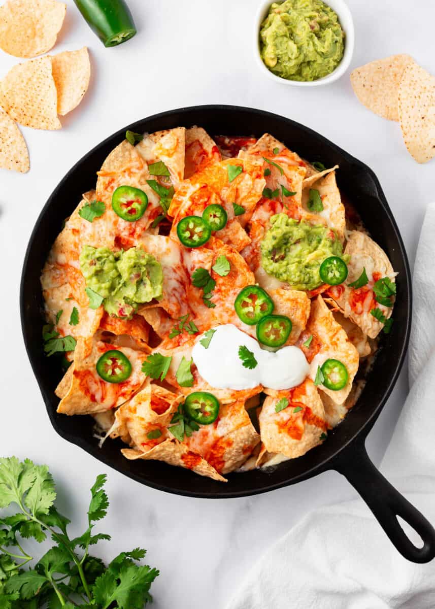 Baked nachos in a skillet.