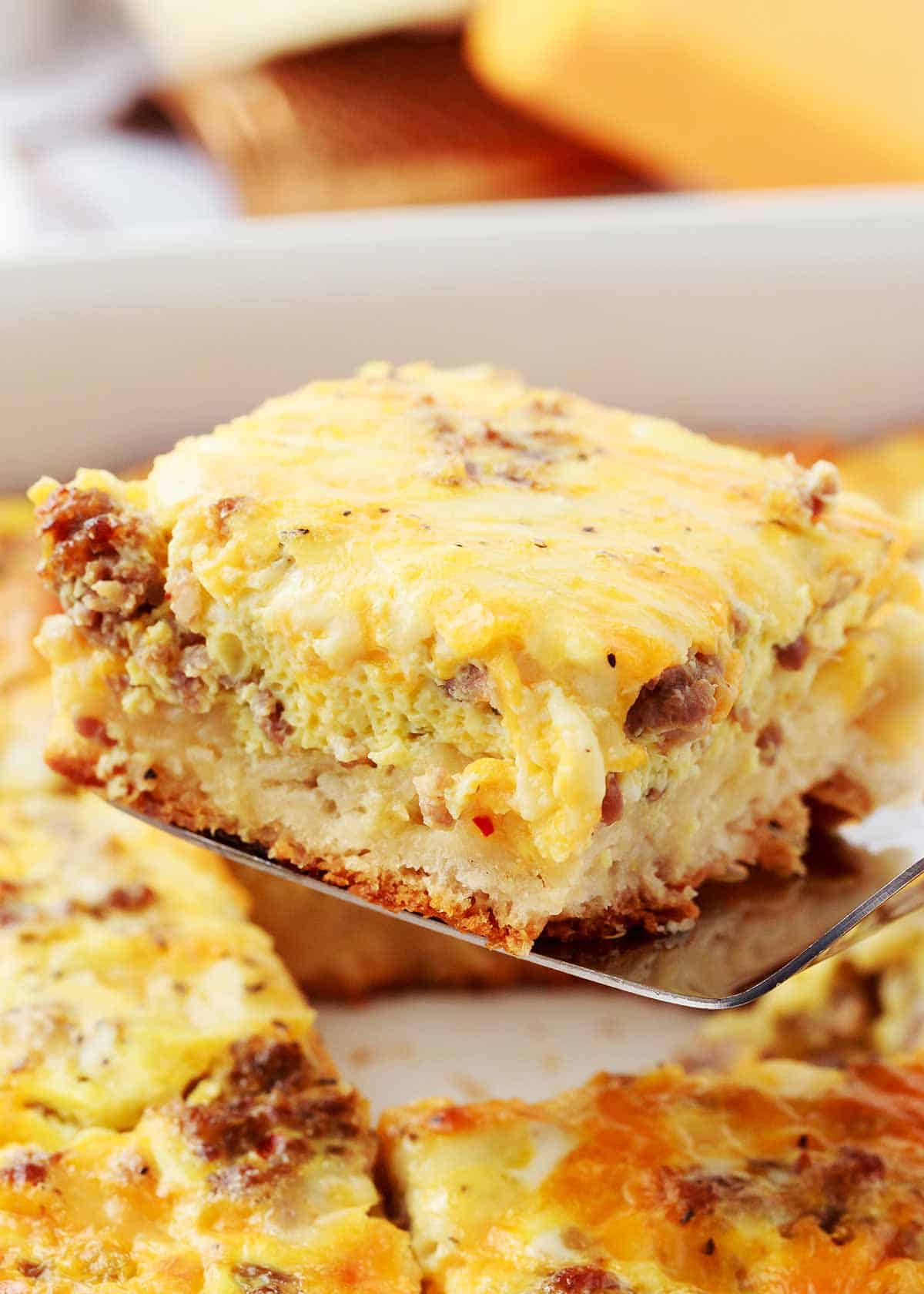 Slice of biscuit breakfast casserole.