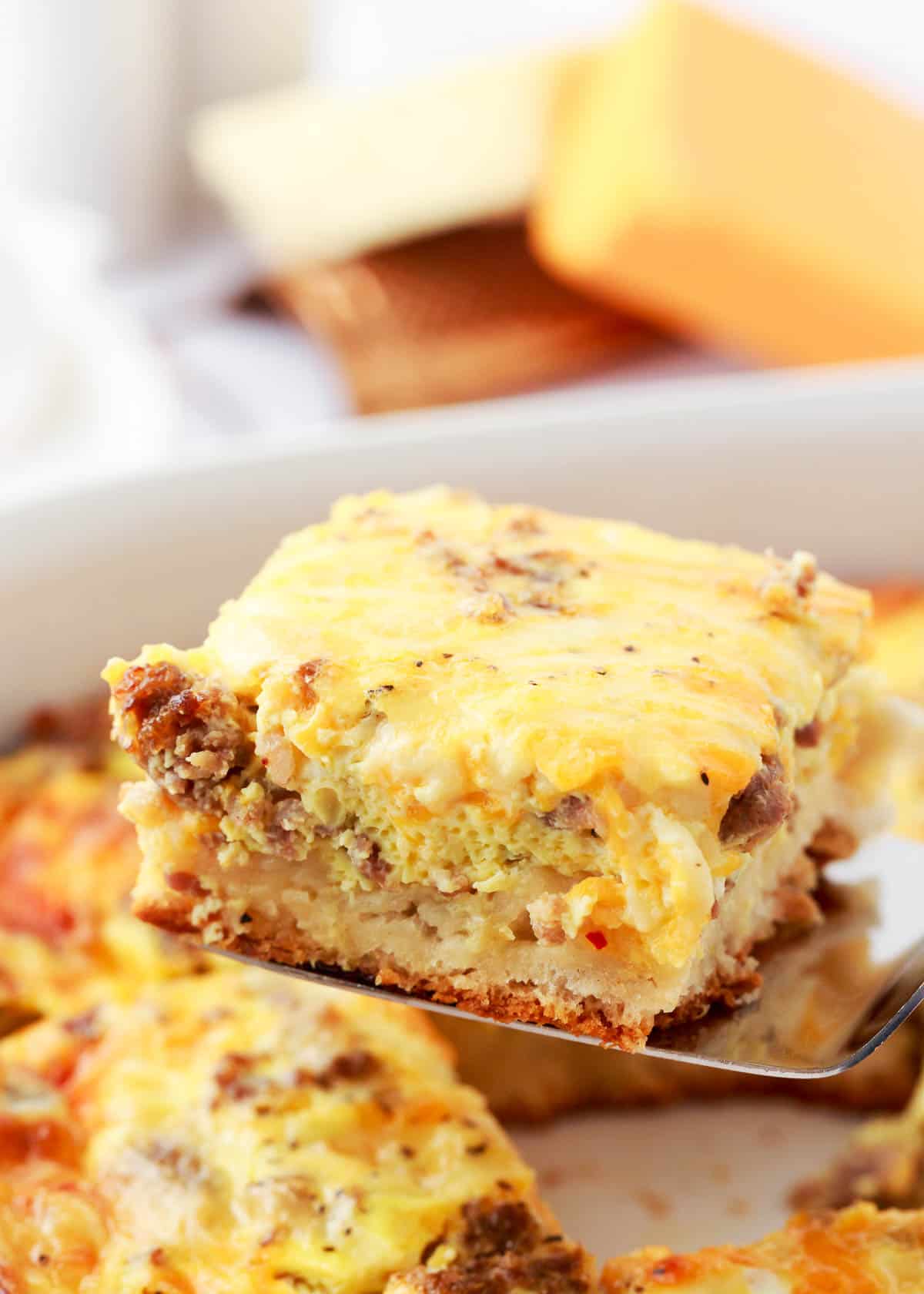 Slice of biscuit breakfast casserole.