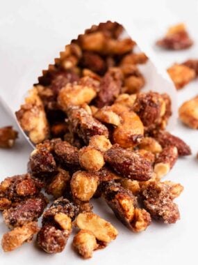 Candied nuts in a white bag.