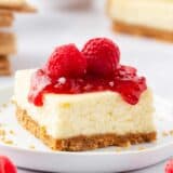 Cheesecake bars with fresh raspberries on top.