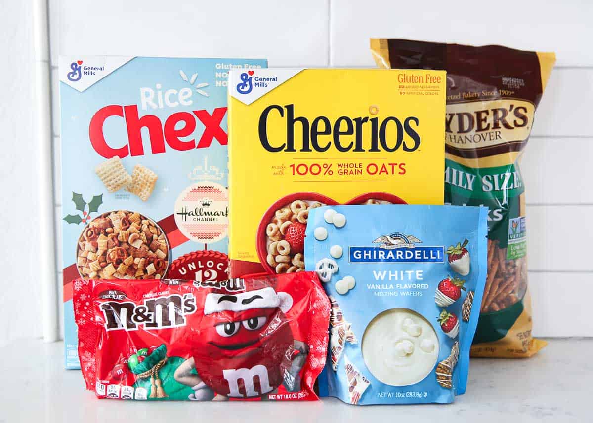 Christmas Chex Mix ingredients on counter.