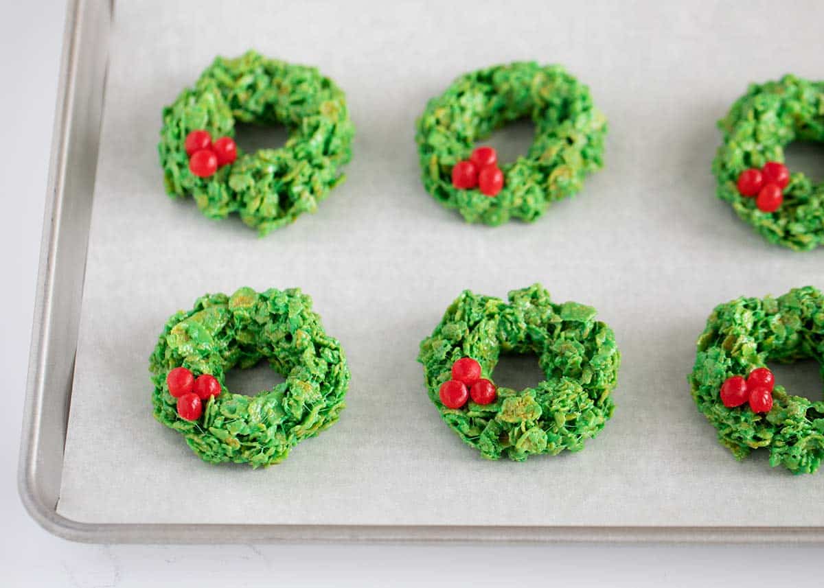 Cornflake wreaths on a baking sheet.