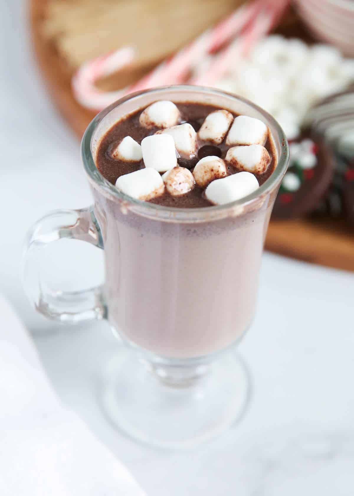 Hot chocolate in a glass with marshmallows.