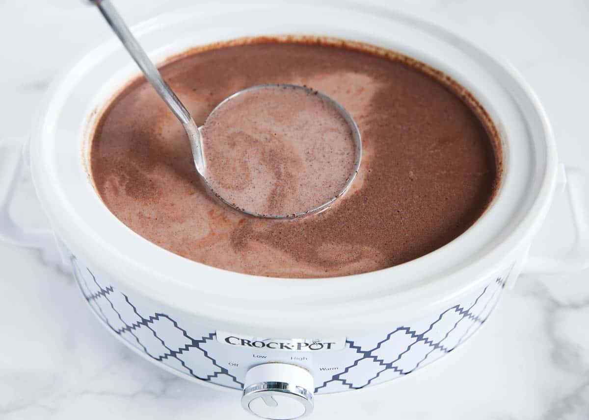 Hot chocolate in a crockpot with ladle.