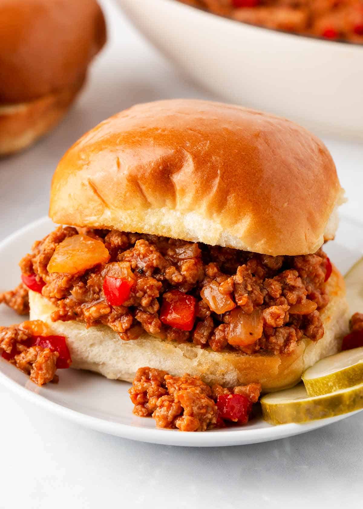 A nostalgic, economical and easy recipe that feeds the whole family. These homemade sloppy joes are hearty, savory and have the best flavor! Easy Sloppy Joe Recipe on a plate.