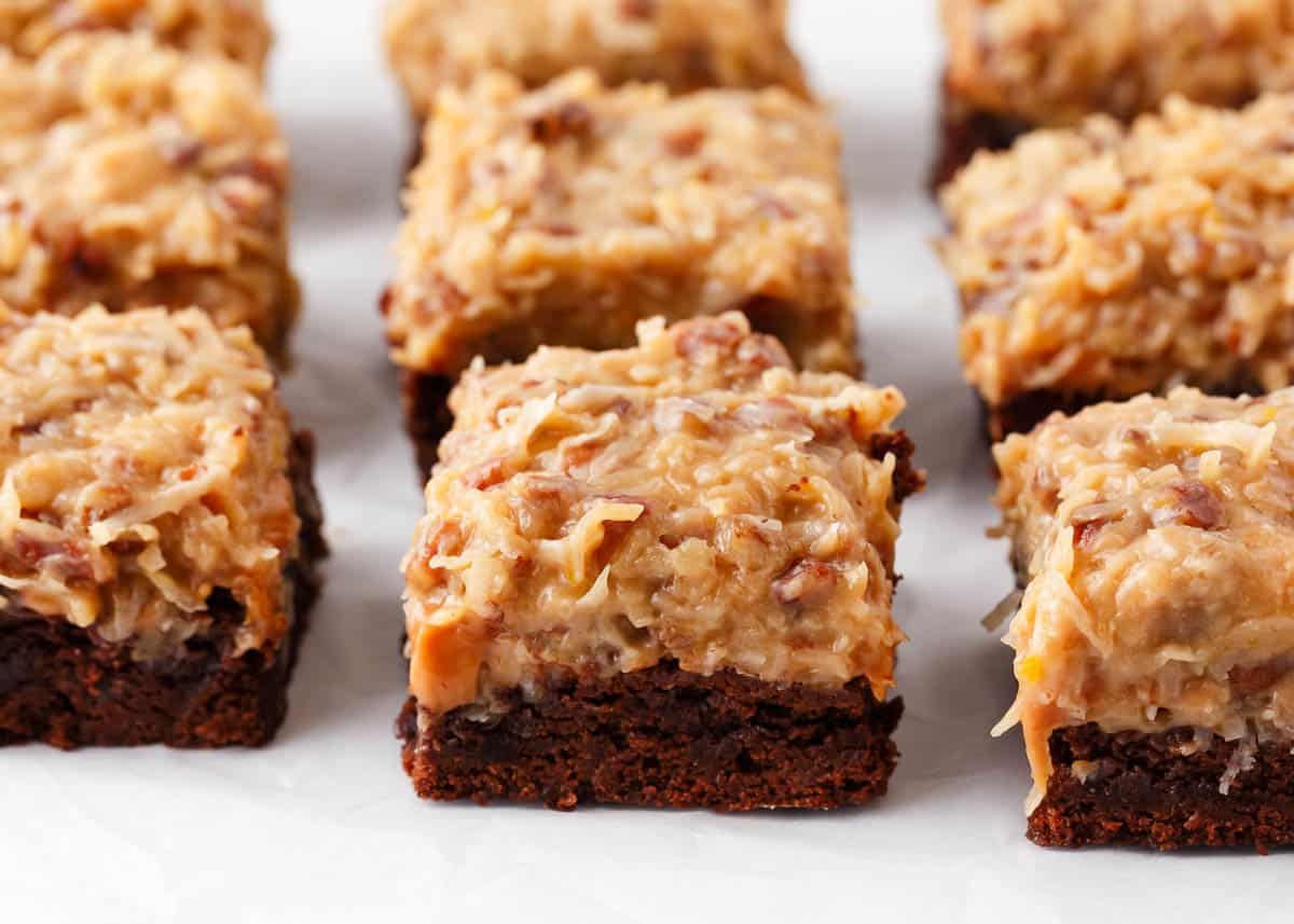 The BEST German chocolate brownies loaded with chocolate, caramel and an amazing coconut pecan frosting. Super rich and full of chocolate goodness!