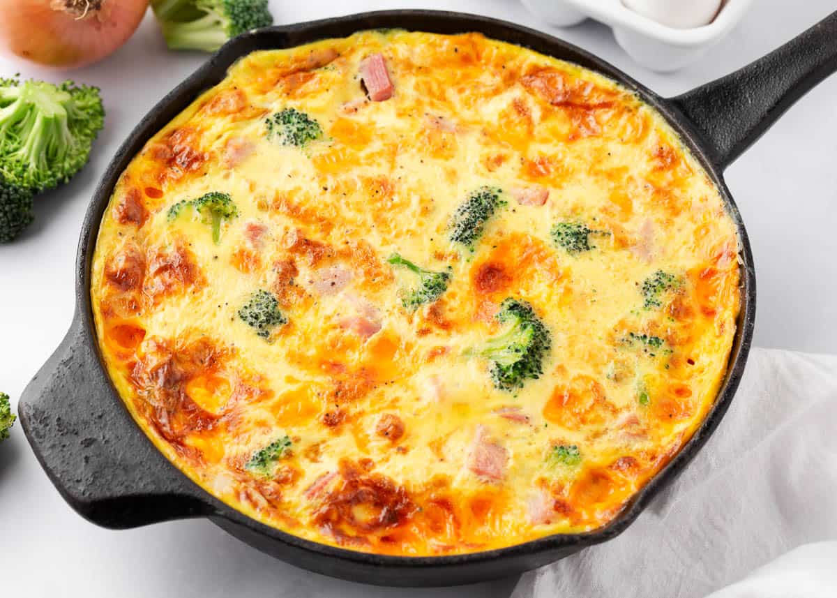 Ham and cheese frittata in an iron skillet.