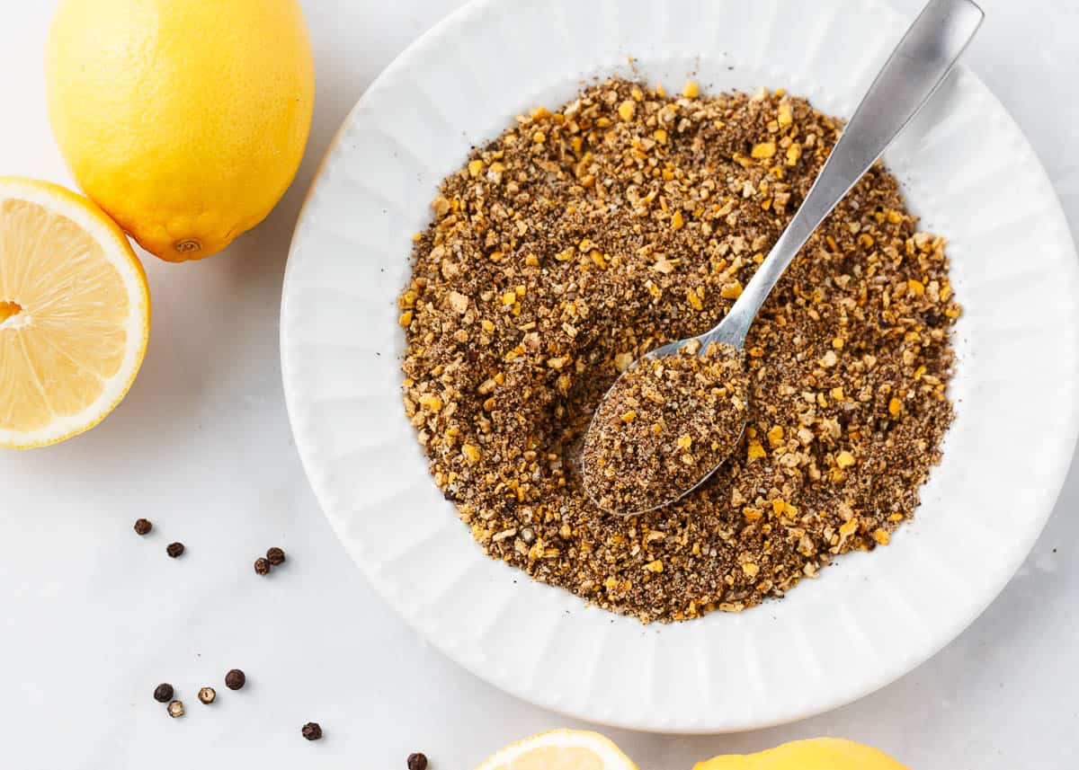 Lemon pepper seasoning in a white bowl.