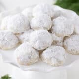 Mexican wedding cookies on a plate.