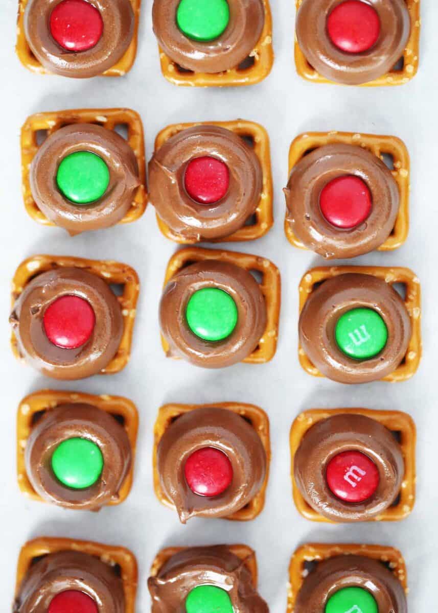 Rolo pretzels on a piece of parchment paper.