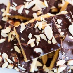 Saltine cracker toffee on a white plate.
